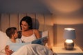 Mother reading bedtime story to her son Royalty Free Stock Photo