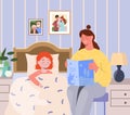 Mother is reading a bedtime story to put her little daughter to bed Royalty Free Stock Photo