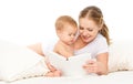 Mother reading book baby in bed before going to sleep Royalty Free Stock Photo