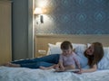 Mother reading a book the baby in bed before going to sleep Royalty Free Stock Photo
