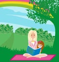 A mother reading a book with her daughter Royalty Free Stock Photo