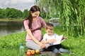 Mother reading book to her child