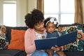 Mother reading a book to her little girl. Royalty Free Stock Photo