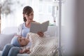 Mother reading book to weak child with leukemia Royalty Free Stock Photo