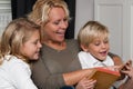 Mother reading to children