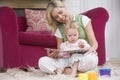 Mother reading to daughter