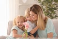 Mother receiving flowers from her cute little children at home Royalty Free Stock Photo