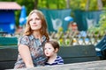 Mother relaxing together with her little child, adorable toddler girl Royalty Free Stock Photo