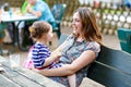 Mother relaxing together with her little child, adorable toddler girl Royalty Free Stock Photo