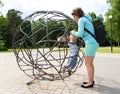 Mother rescues her little son from the sphere cage