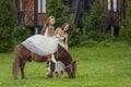 mother rides her daughter on a pony Royalty Free Stock Photo