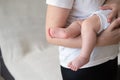 mother rock little baby boy. Sleeping child bare feet. Happy family Royalty Free Stock Photo