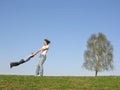 Mother rotate son on meadow Royalty Free Stock Photo
