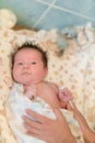 Mother rubs baby after bathing. the boy smiles and feels happy after taking a bath. mother dries and rubs the hair of the newborn Royalty Free Stock Photo