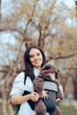 Cheerful Mom Walking her Cute Infant in Baby Carrier Royalty Free Stock Photo