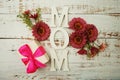 Mother`s day background with Mom alphabet letters and Flowers and gift box on wooden background Royalty Free Stock Photo