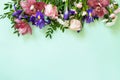 Mother`s day or birthday background. Spring beautiful bouquet of blooming rose, orchids, carnations and irises and spring greener Royalty Free Stock Photo