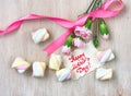 Mother`s day card, pink carnations and marshmallows