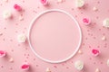 Top view photo of empty circle small roses hearts and sprinkles on isolated pastel pink background with copyspace