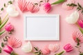 Top view photo of photo frame tulips and origami paper hearts on isolated pastel pink background with copyspace