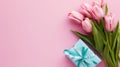 Mother's Day decorations concept. Top view photo of trendy gift boxes with ribbon bows and tulips on isolated pastel Royalty Free Stock Photo