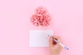 Mother`s Day design concept - Pink carnations on a pale pink background with gratitude greeting card and words, top view, flat la