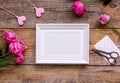 Mother`s day gift with peony flowers and frame top view mockup Royalty Free Stock Photo