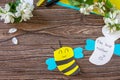 Mother`s day greeting card gift - bee with spring apple tree flowers on a wooden table. Childrens creativity project, handmade, Royalty Free Stock Photo