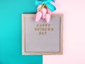 Mother`s day greetings on letter board and tulips Royalty Free Stock Photo