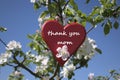 Mother`s day greetings with a red wooden heart