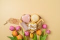 Mother\'s day heart shape gift box with natural eco friendly home spa products and tulip flowers on beige background. Royalty Free Stock Photo