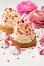 Mother`s day holiday brunch with cupcake craem and pink flowers on white background
