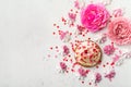 Mother`s day holiday brunch with cupcake craem and pink flowers on white background