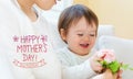 Mother`s Day message with toddler boy with his mother