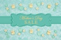 Mother`s Day Sale message with teal candy hearts, teddy bears and rose buds on a teal plush fabric