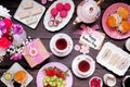 Mothers Day tea table scene over a dark wood background Royalty Free Stock Photo