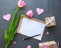 Mother`s Day, woman`s day. tulips ,presents and letter on wooden background Royalty Free Stock Photo