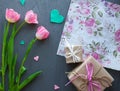 Mother`s Day, woman`s day. tulips ,presents and letter on wooden background Royalty Free Stock Photo