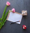 Mother`s Day, woman`s day. tulips ,presents and letter on wooden background Royalty Free Stock Photo