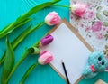 Mother`s Day, woman`s day. tulips ,presents and letter on wooden background Royalty Free Stock Photo