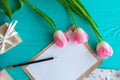 Mother`s Day, woman`s day. tulips ,presents and letter on wooden background Royalty Free Stock Photo