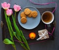 Mother`s Day, woman`s day. tulips ,presents ,tea and sweets on wooden background Royalty Free Stock Photo