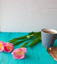 Mother`s Day, woman`s day. tulips ,presents ,tea and sweets on wooden background Royalty Free Stock Photo