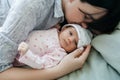 A mother`s daytime sleep with her newborn baby