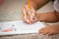 Mother's hand holding child hand writing her homework Royalty Free Stock Photo