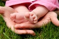 Mother's hands cradling her infant Royalty Free Stock Photo