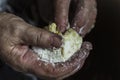 Mother`s hands unroll dough for pies. Pies with eggs and onions. Cooking pies Royalty Free Stock Photo