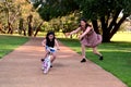 Mother screaming while her daughter riding a bike loosing balance Royalty Free Stock Photo