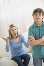 Mother Shouting While Son Ignoring Her At Home Royalty Free Stock Photo