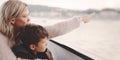 Mother showing away to son on cruise tour